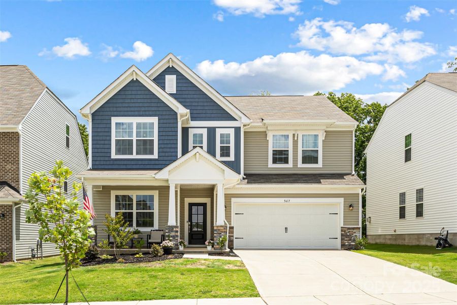 Front exterior of a new home in Walnut Creek: Enclave, Lancaster, SC, highlighting curb appeal (Image 17). Front exterior of a new home in Walnut Creek: Enclave, Lancaster, SC, highlighting curb appeal (Image 17).