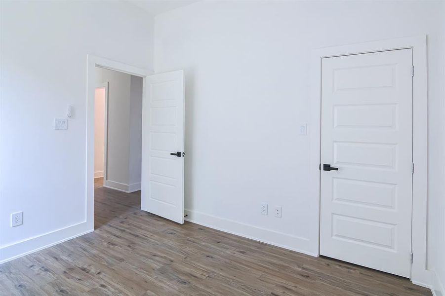 Empty room featuring hardwood / wood-style floors