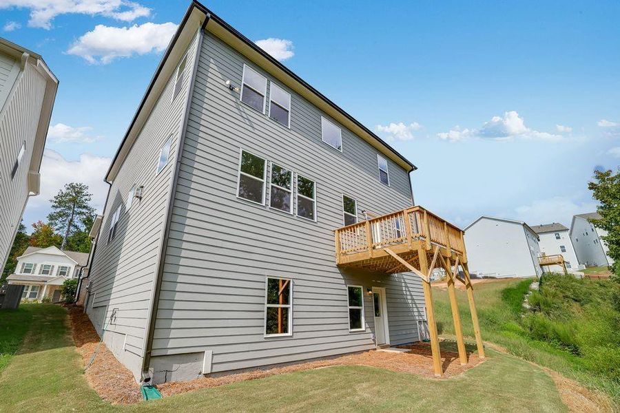 Front exterior of a new home in Falls Creek, Flowery Branch, GA, highlighting curb appeal (Image 24).