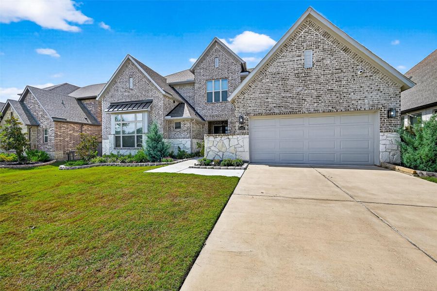 Front exterior of a new home in , Richmond, TX, highlighting curb appeal (Image 2). Front exterior of a new home in , Richmond, TX, highlighting curb appeal (Image 2).
