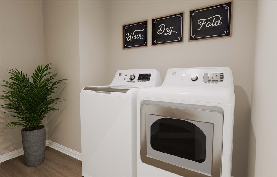 Laundry area with wood finished floors, washing machine and clothes dryer, baseboards, and laundry area Laundry area with wood finished floors, washing machine and clothes dryer, baseboards, and laundry area