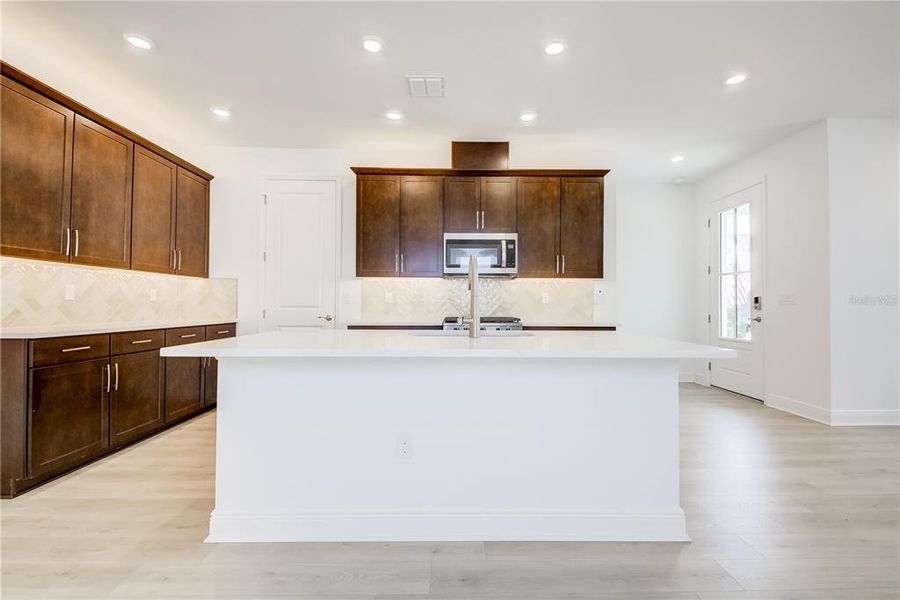 Furnished interior view inside a new home in Bungalow Walk at Lakewood Ranch, Sarasota (Image 11).