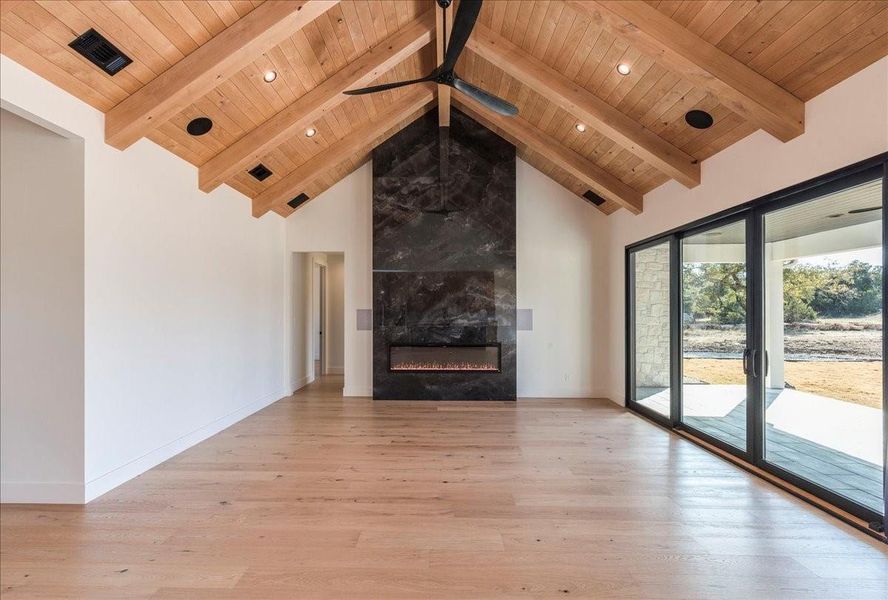 Another perspective of the stunning living space, where Pella sliding glass doors flood the room with natural light