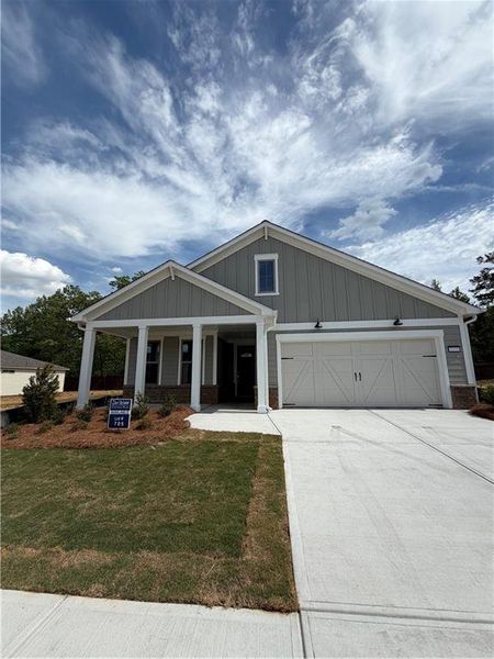 Front exterior of a new home in Del Webb Chateau Elan, Hoschton, GA, highlighting curb appeal (Image 1). Front exterior of a new home in Del Webb Chateau Elan, Hoschton, GA, highlighting curb appeal (Image 1).