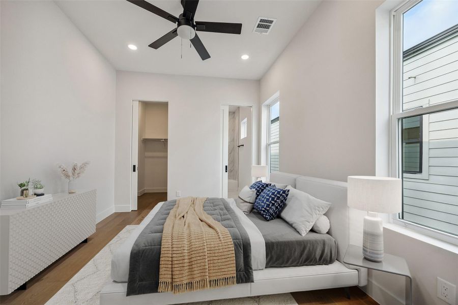 The proportions of the secondary bedroom allow the space to feel open while still remaining practical for furniture placement and everyday use. Clean lines and warm flooring continue the home’s consistent finish palette. (digitally staged) The proportions of the secondary bedroom allow the space to feel open while still remaining practical for furniture placement and everyday use. Clean lines and warm flooring continue the home’s consistent finish palette. (digitally staged)