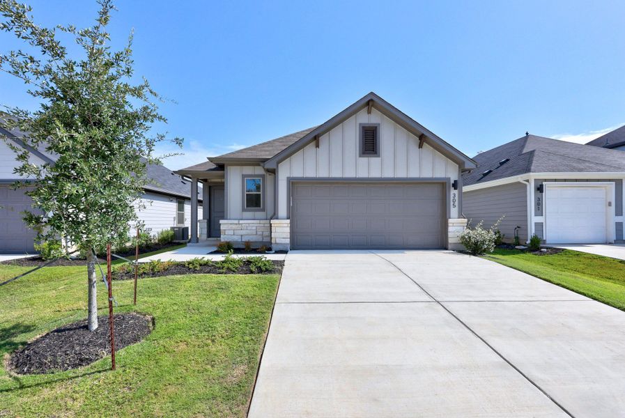 Front exterior of a new home in Trinity Ranch, Elgin, TX, highlighting curb appeal (Image 21).