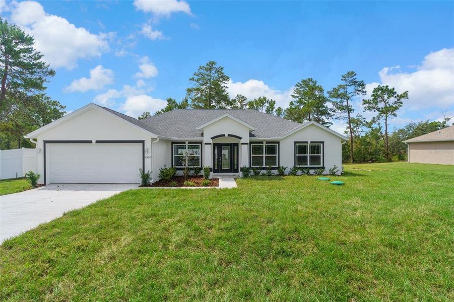 Front exterior of a new home in , Weeki Wachee, FL, highlighting curb appeal (Image 19).