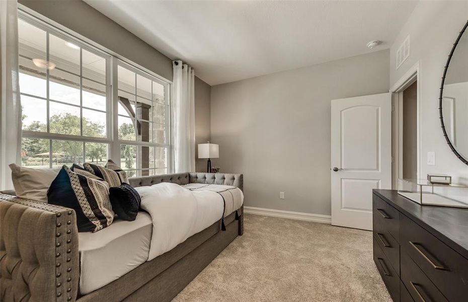 *Model Representation - Spacious secondary bedroom with large windows