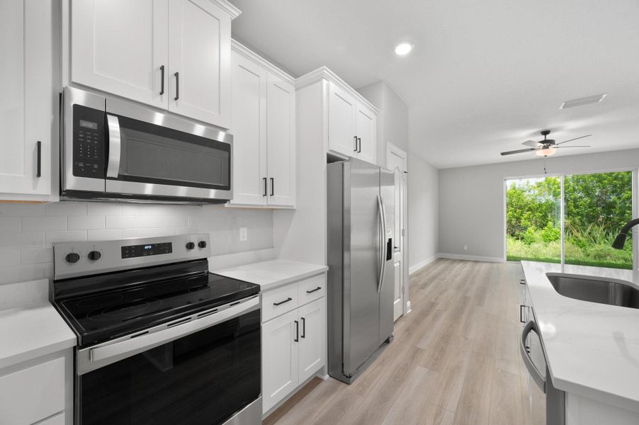 Furnished interior view inside a new home in Celebration Pointe, Fort Pierce (Image 7).