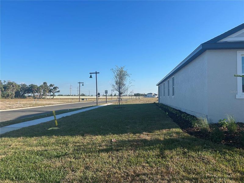Exterior details and patio area of a home in Oakfield Trails Traditional, Parrish (Image 2).