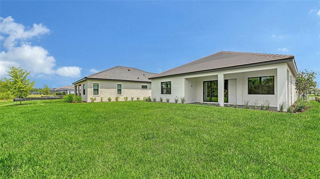 Exterior details and patio area of a home in Vistera of Venice, Nokomis (Image 16).