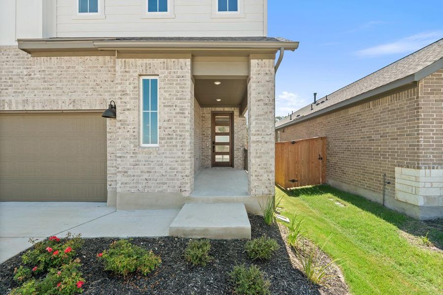 Exterior details and patio area of a home in Terrace Collection at Lariat, Liberty Hill (Image 21). Exterior details and patio area of a home in Terrace Collection at Lariat, Liberty Hill (Image 21).