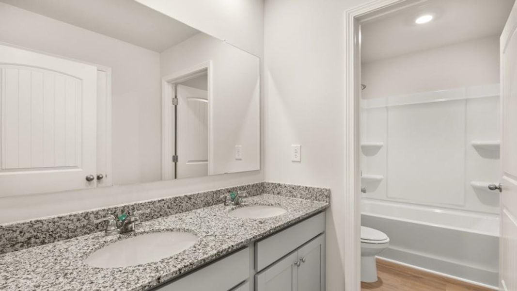 Furnished interior view inside a new home in Northwoods at Mirror Lake, Villa Rica (Image 5).