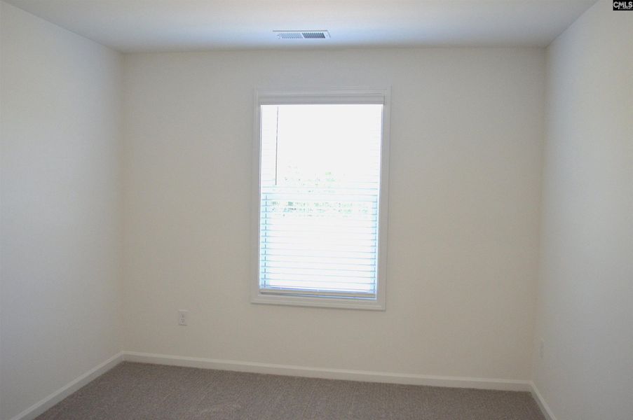 Spacious, unfurnished interior of a new home in Bickley Station, Irmo (Image 26).