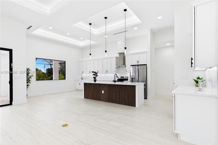 QUARTZ COUNTERTOPS & FULL-HEIGHT QUARTZ BACKSPLASH w/ clean modern palette, while UNDER-CABINET LED LIGHTING enhances bright, open ambiance. QUARTZ COUNTERTOPS & FULL-HEIGHT QUARTZ BACKSPLASH w/ clean modern palette, while UNDER-CABINET LED LIGHTING enhances bright, open ambiance.