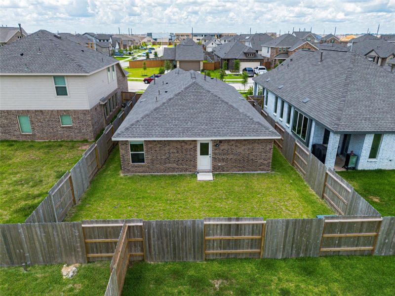 Exterior details and patio area of a home in Sunterra, Katy (Image 23).