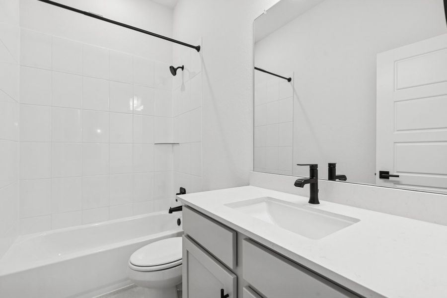 Representative furnished interior of a home built from the The Denton by David Weekley Homes in South Brook, Leander (Image 4).