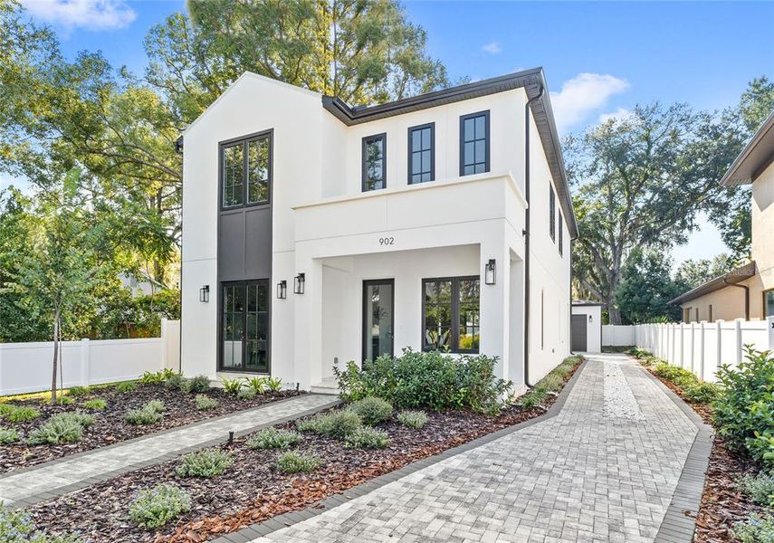 Front exterior of a new home in , Orlando, FL, highlighting curb appeal (Image 29). Front exterior of a new home in , Orlando, FL, highlighting curb appeal (Image 29).