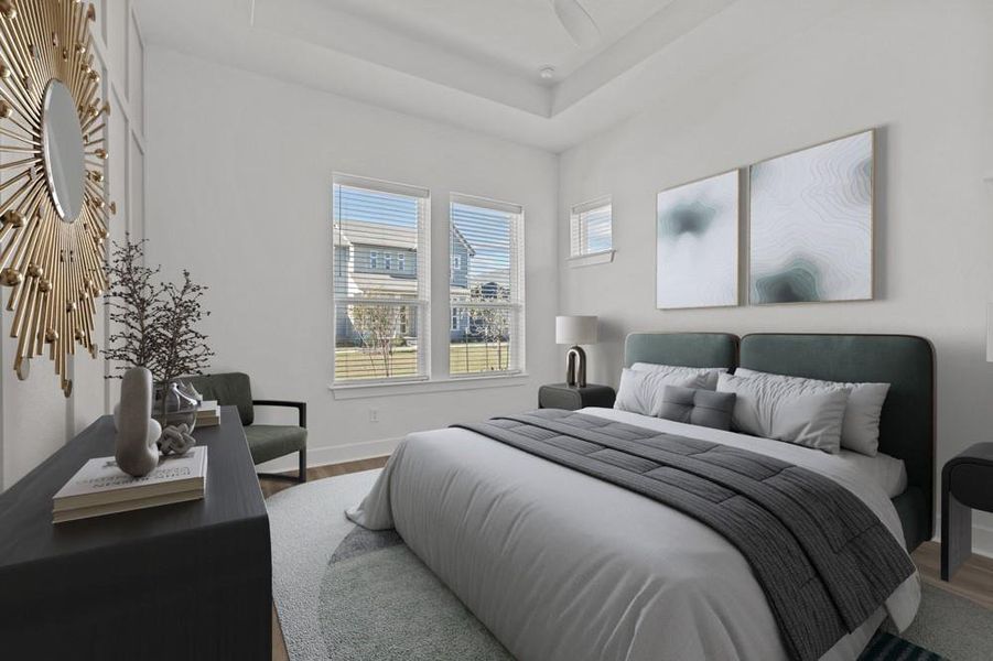 Bedroom with baseboards and wood finished floors