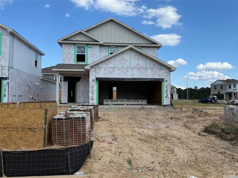 Exterior details and patio area of a home in Lakes at Black Oak, Magnolia (Image 2).