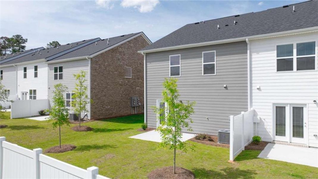 Exterior details and patio area of a home in Echo Glen, Stockbridge (Image 10).