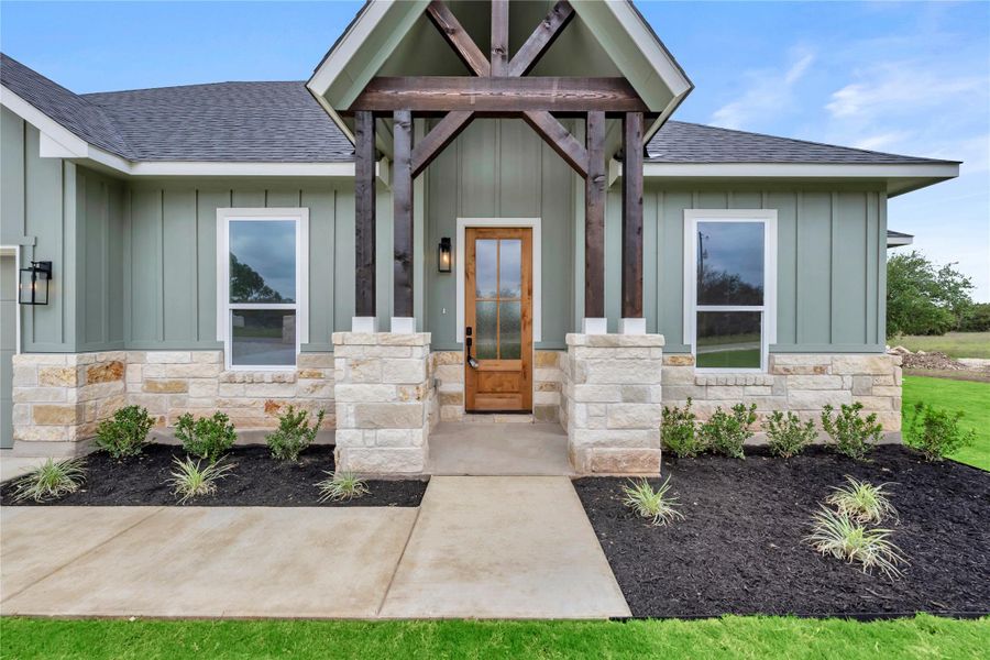 Front exterior of a new home in , Bertram, TX, highlighting curb appeal (Image 2).