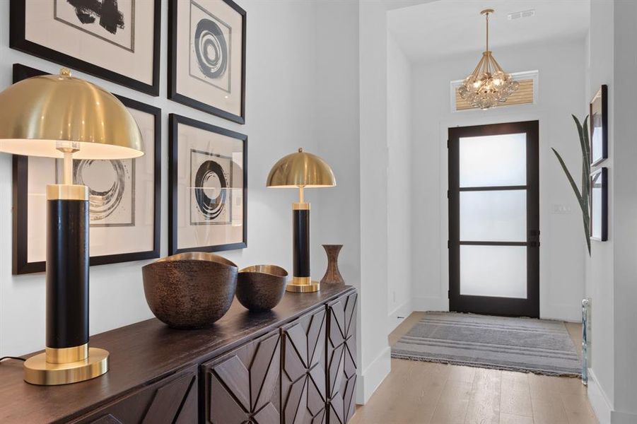 Entryway with a chandelier, Hardwood finished white oak floors, and baseboards. Light and Bright throughout! Entryway with a chandelier, Hardwood finished white oak floors, and baseboards. Light and Bright throughout!