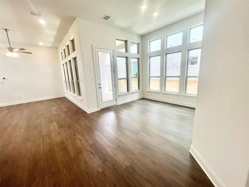 Unfurnished living room featuring dark wood-type flooring, recessed lighting, and ceiling fan Unfurnished living room featuring dark wood-type flooring, recessed lighting, and ceiling fan