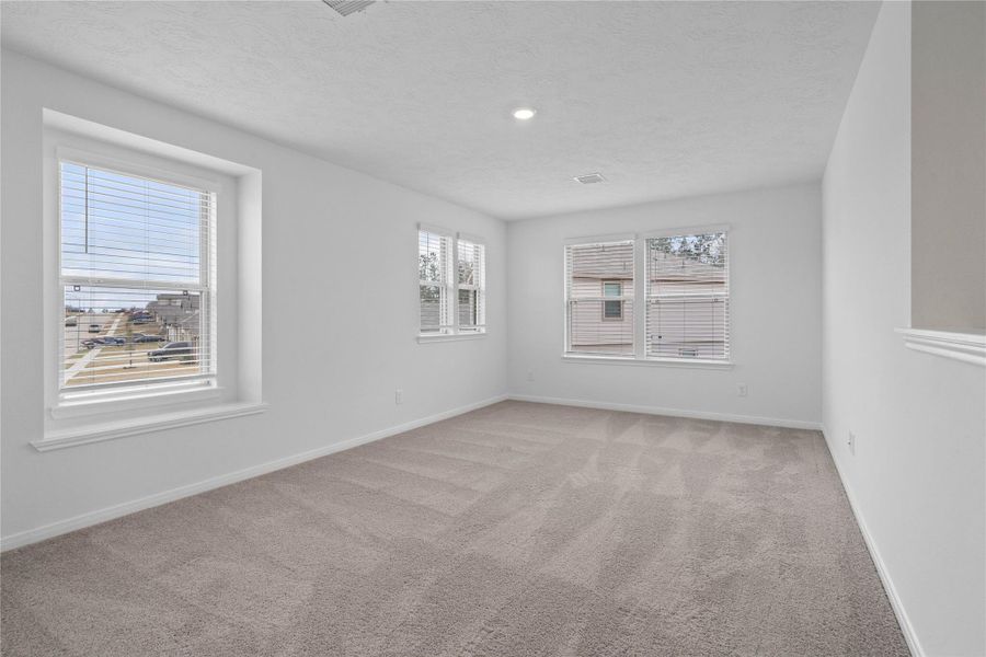 Head upstairs and enjoy the Loft—an additional living area perfect for a game room, media space, or a peaceful retreat. It features plush carpeting and large windows with privacy blinds!