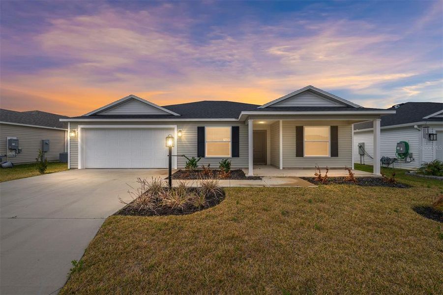 Front exterior of a new home in , The Villages, FL, highlighting curb appeal (Image 1). Front exterior of a new home in , The Villages, FL, highlighting curb appeal (Image 1).