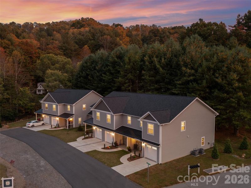 Front exterior of a new home in , Burnsville, NC, highlighting curb appeal (Image 23).
