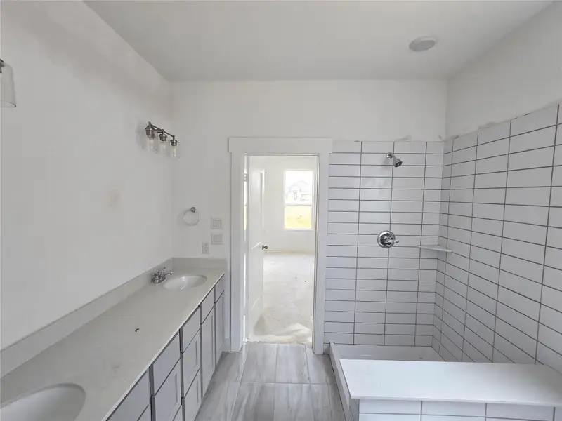 The elegant finishes, from the dazzling floors to the chic light fixtures, reflect a careful attention to detail that feels both luxurious and comforting.