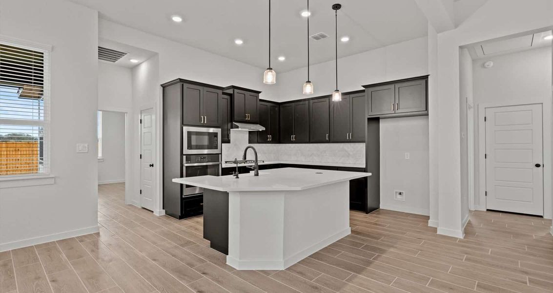 Representative furnished interior of a home built from the Rhyan by Chesmar Homes in Stream Waters, Seguin (Image 5). Representative furnished interior of a home built from the Rhyan by Chesmar Homes in Stream Waters, Seguin (Image 5).