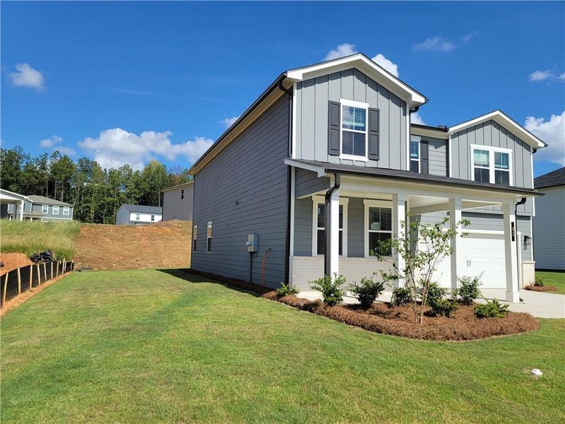 Front exterior of a new home in Reserve at Gum Springs, Jefferson, GA, highlighting curb appeal (Image 2). Front exterior of a new home in Reserve at Gum Springs, Jefferson, GA, highlighting curb appeal (Image 2).