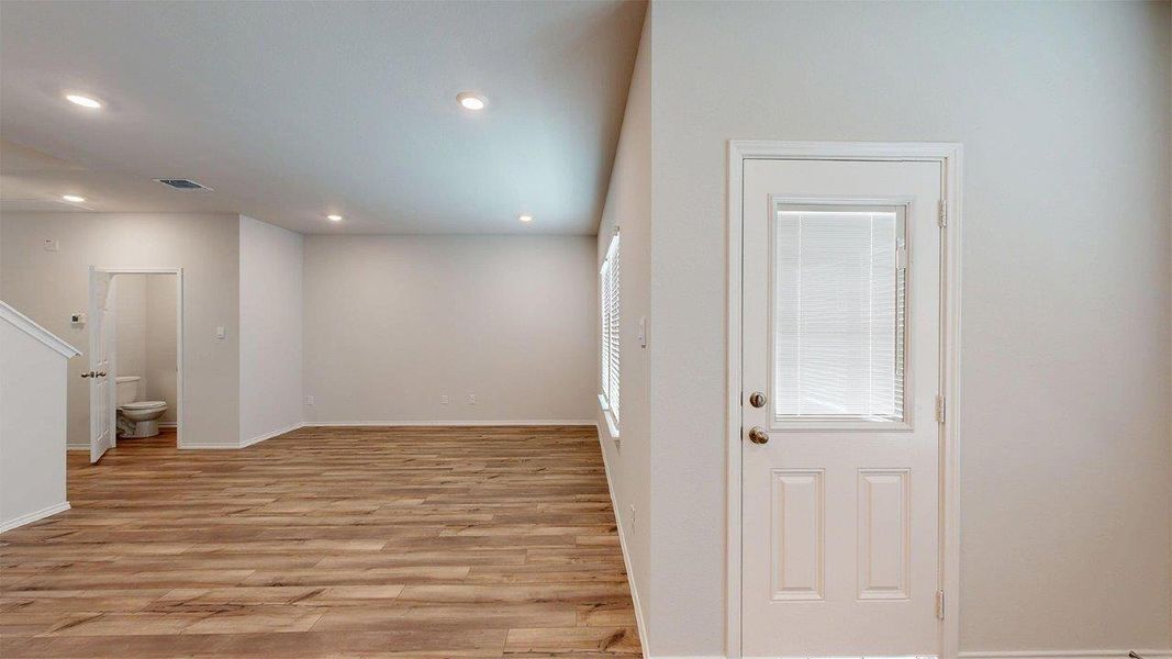 Spare room featuring light wood finished floors and recessed lighting Spare room featuring light wood finished floors and recessed lighting