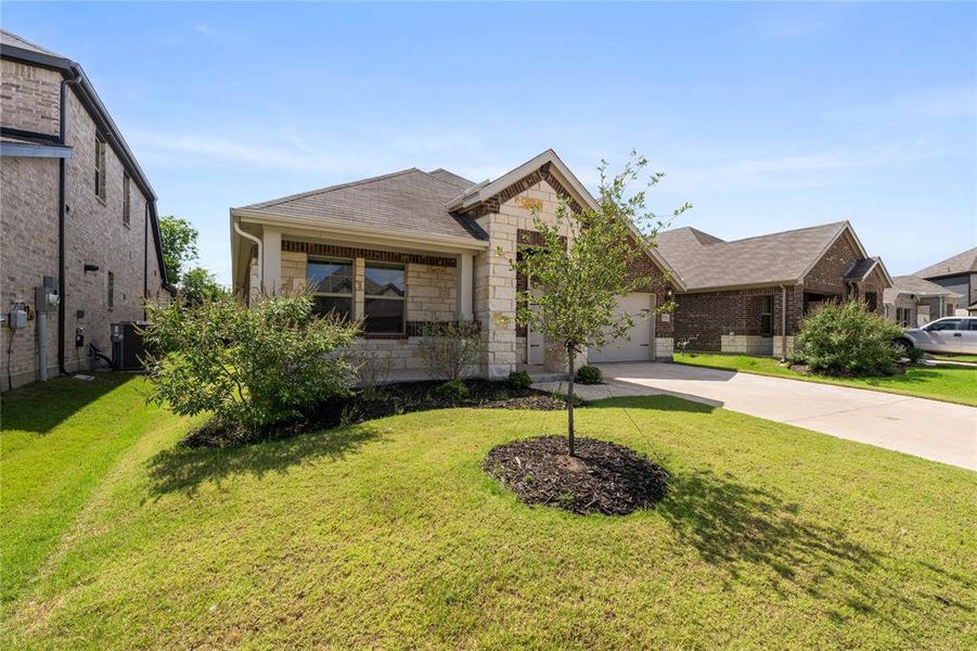 Front exterior of a new home in Lakehaven - Signature Series, Farmersville, TX, highlighting curb appeal (Image 1). Front exterior of a new home in Lakehaven - Signature Series, Farmersville, TX, highlighting curb appeal (Image 1).