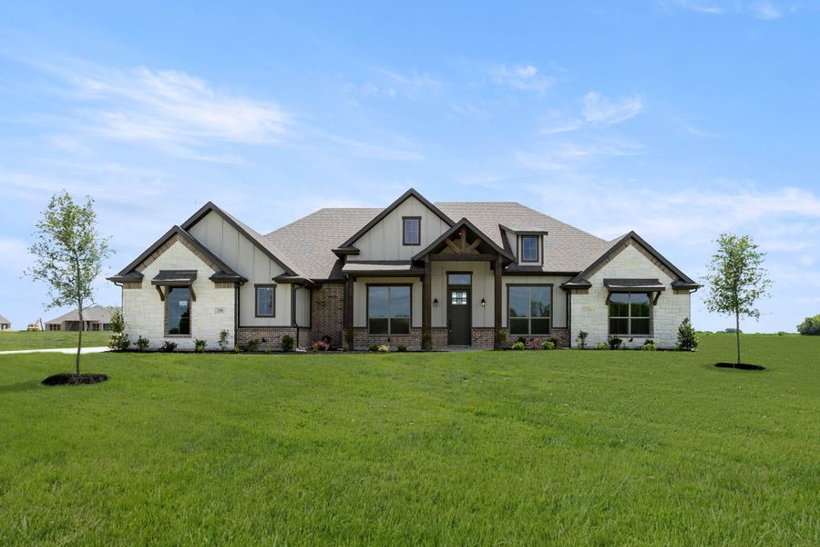 Front exterior of a new home in Pecan Acres, Red Oak, TX, highlighting curb appeal (Image 1). Front exterior of a new home in Pecan Acres, Red Oak, TX, highlighting curb appeal (Image 1).