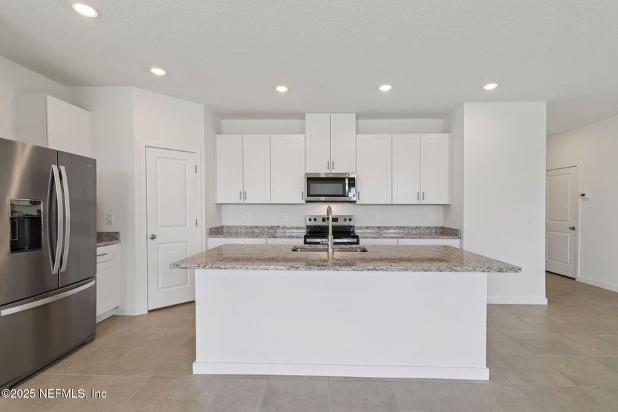 Furnished interior view inside a new home in Lakes at Bella Lago - Signature Series, Green Cove Springs (Image 7). Furnished interior view inside a new home in Lakes at Bella Lago - Signature Series, Green Cove Springs (Image 7).