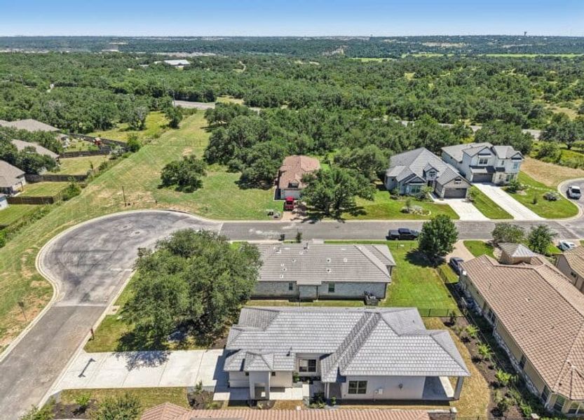 Front exterior of a new home in Cimarron Hills – Villas & Country Club, Georgetown, TX, highlighting curb appeal (Image 55).
