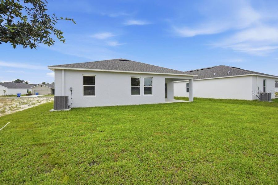 Exterior details and patio area of a home in Palm Wind, Hudson (Image 17).