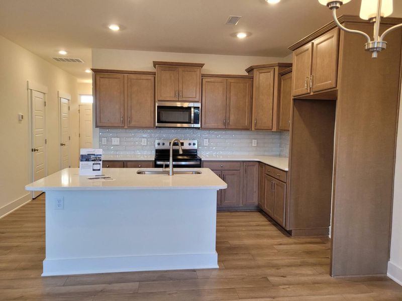 Furnished interior view inside a new home in 1158 Place Townhomes, Wilson (Image 6).