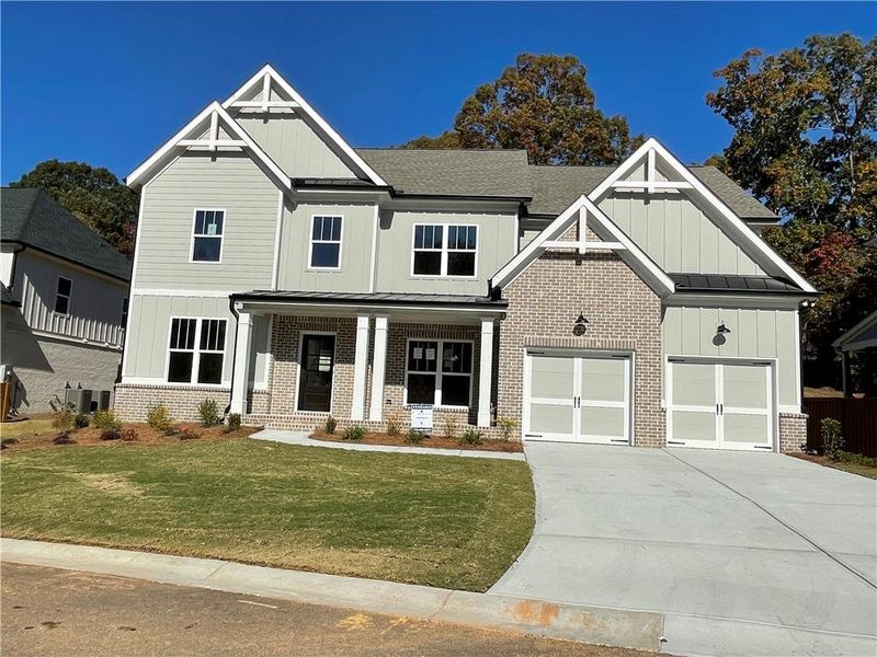 Front exterior of a new home in , Marietta, GA, highlighting curb appeal (Image 1). Front exterior of a new home in , Marietta, GA, highlighting curb appeal (Image 1).