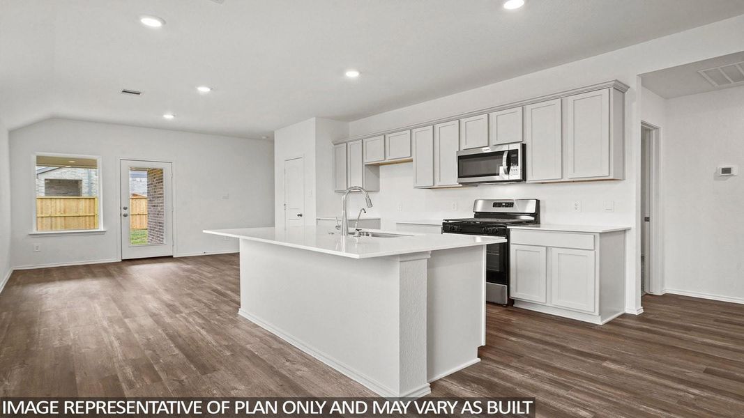 Lovely modern, open-concept kitchen and living area with sleek white cabinetry, stainless steel appliances, and a spacious island! Lovely modern, open-concept kitchen and living area with sleek white cabinetry, stainless steel appliances, and a spacious island!