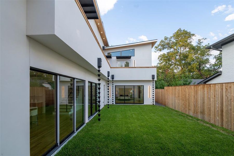 Back of house featuring a lawn