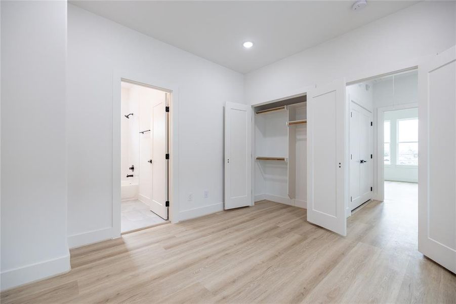 The spacious closet with abundant hanging space adds even more convenience to this well-appointed room