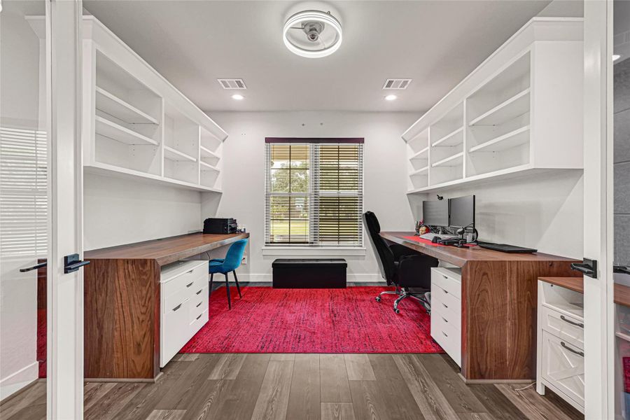 Home office with glass french doors, 2 built in 3x8  Walnut desks and upper shelving