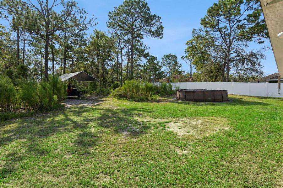 Exterior details and patio area of a home in Royal Highlands, Weeki Wachee (Image 23).