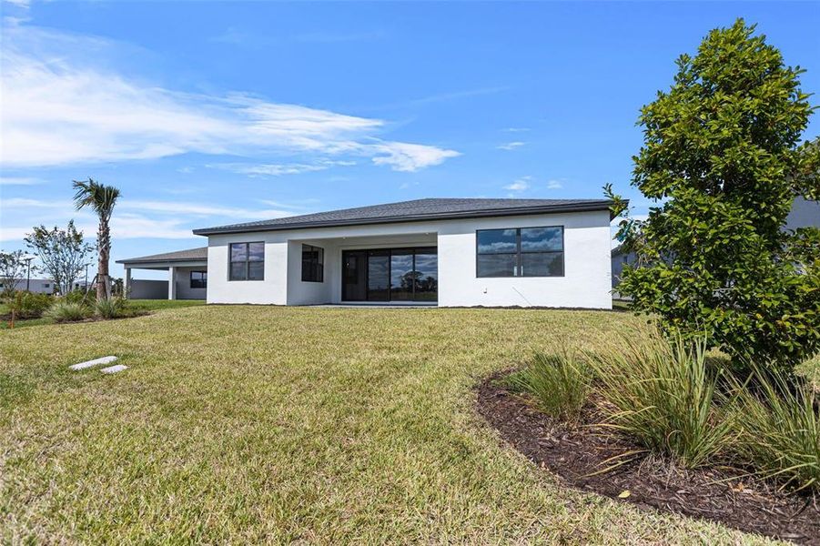 Exterior details and patio area of a home in Woodland Preserve, Parrish (Image 3).