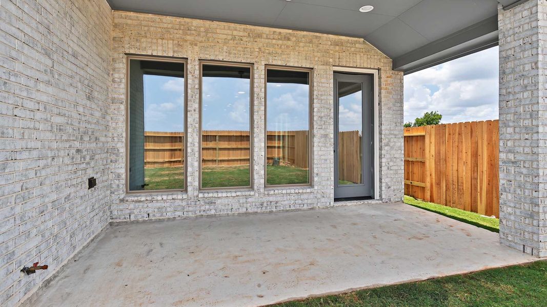 Exterior details and patio area of a home in Lakes of Cane Island, Katy (Image 2).