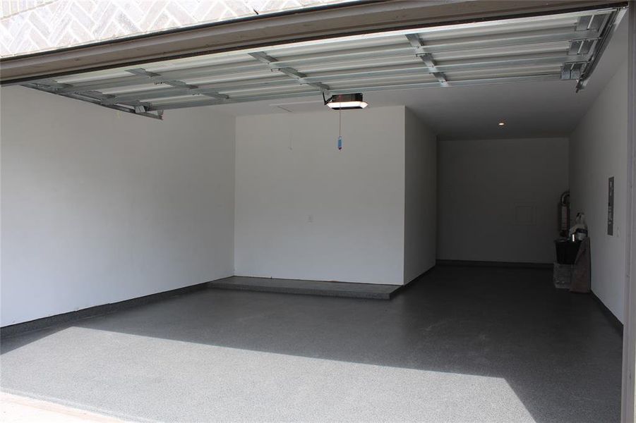 Garage featuring a garage door opener